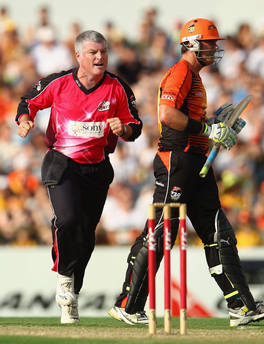 Stuart MacGill celebrates dismissing Marcus North