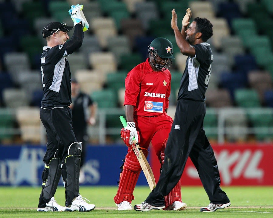 Tarun Nethula and Brendon McCullum celebrate Prosper Utseya's wicket