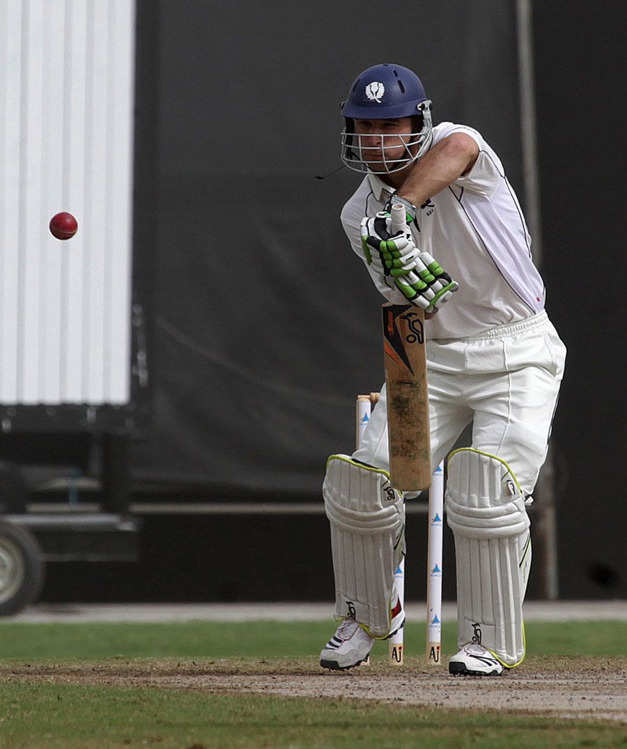 Simon Smith defends during his half-century