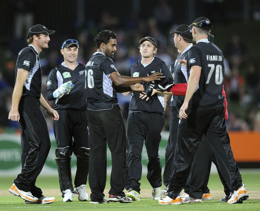 Tarun Nethula is congratulated on dismissing JP Duminy 