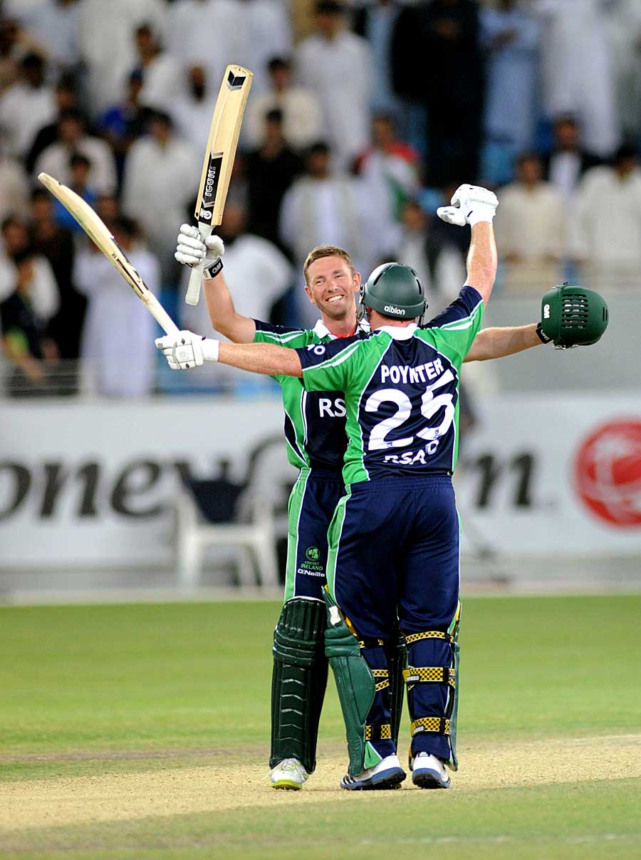 Andrew White and Andrew Poynter celebrate Ireland's title triumph