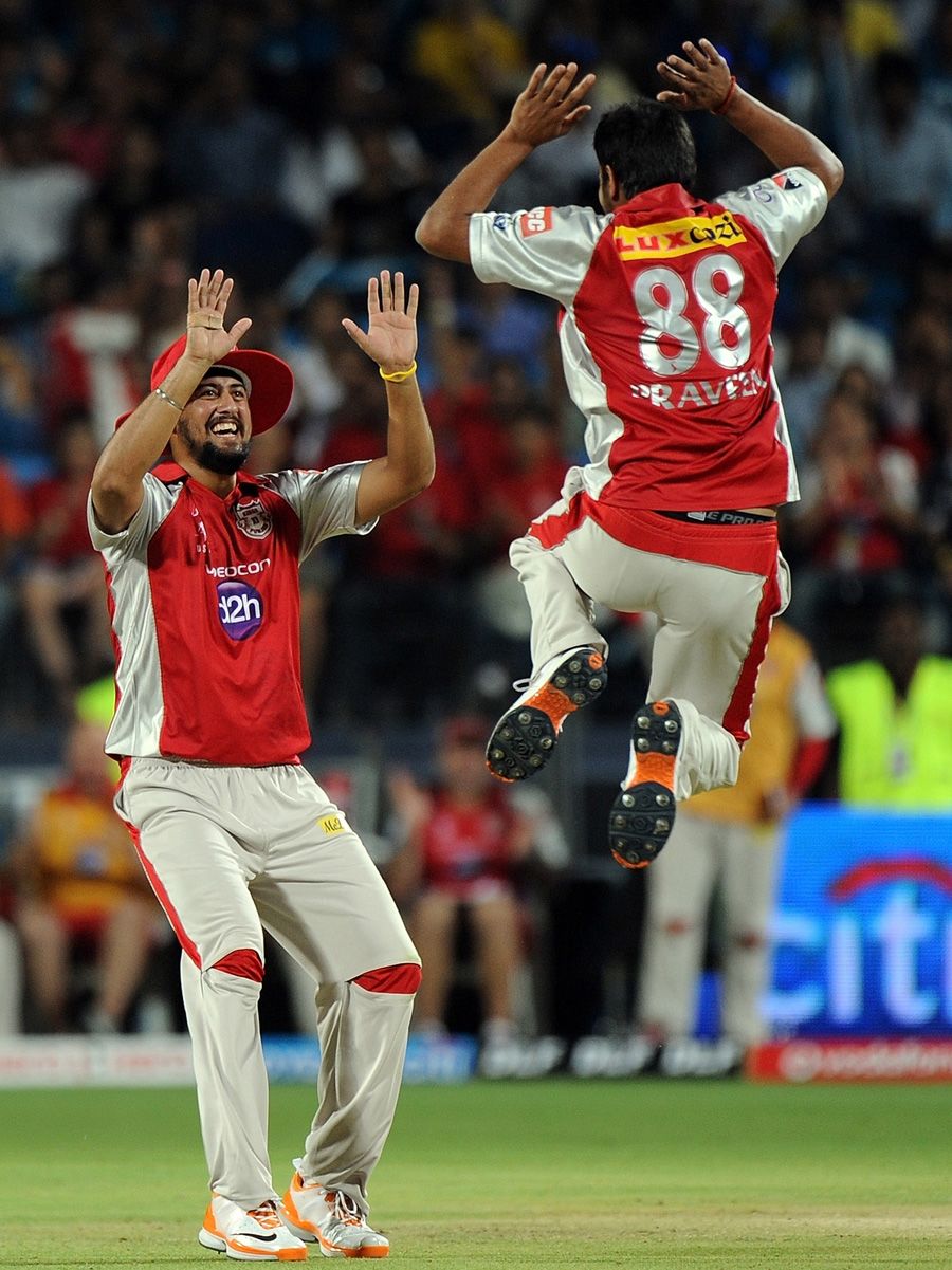 Harmeet Singh and Praveen Kumar celebrate a wicket