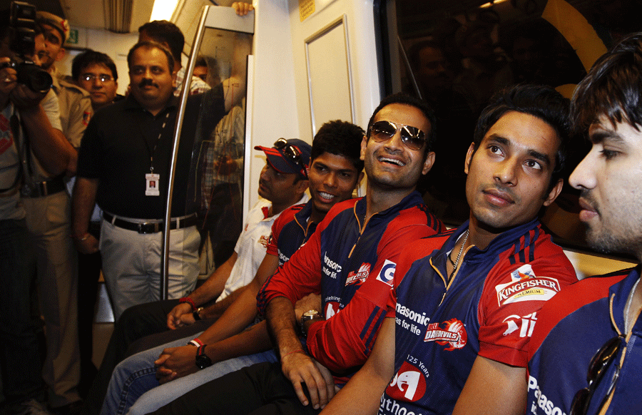 Delhi Daredevils players take a ride on the Delhi metro