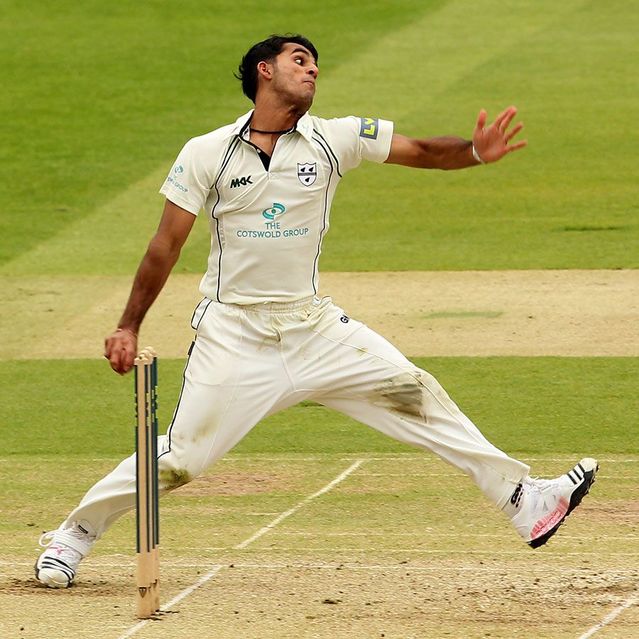 Aneesh Kapil arrives at the wicket to bowl