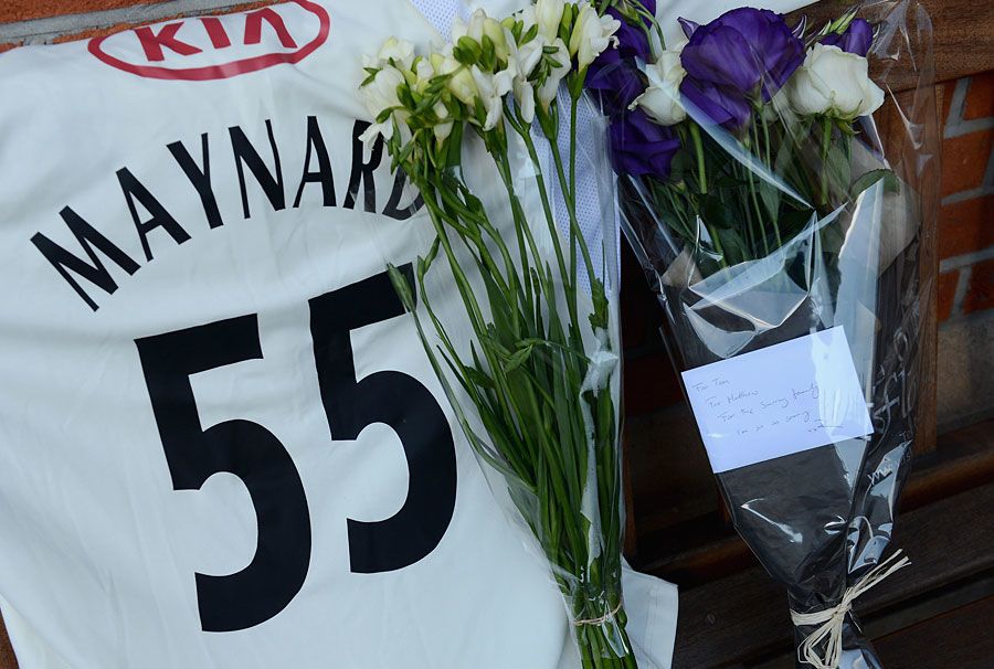 Flowers start to collect in memory of Tom Maynard