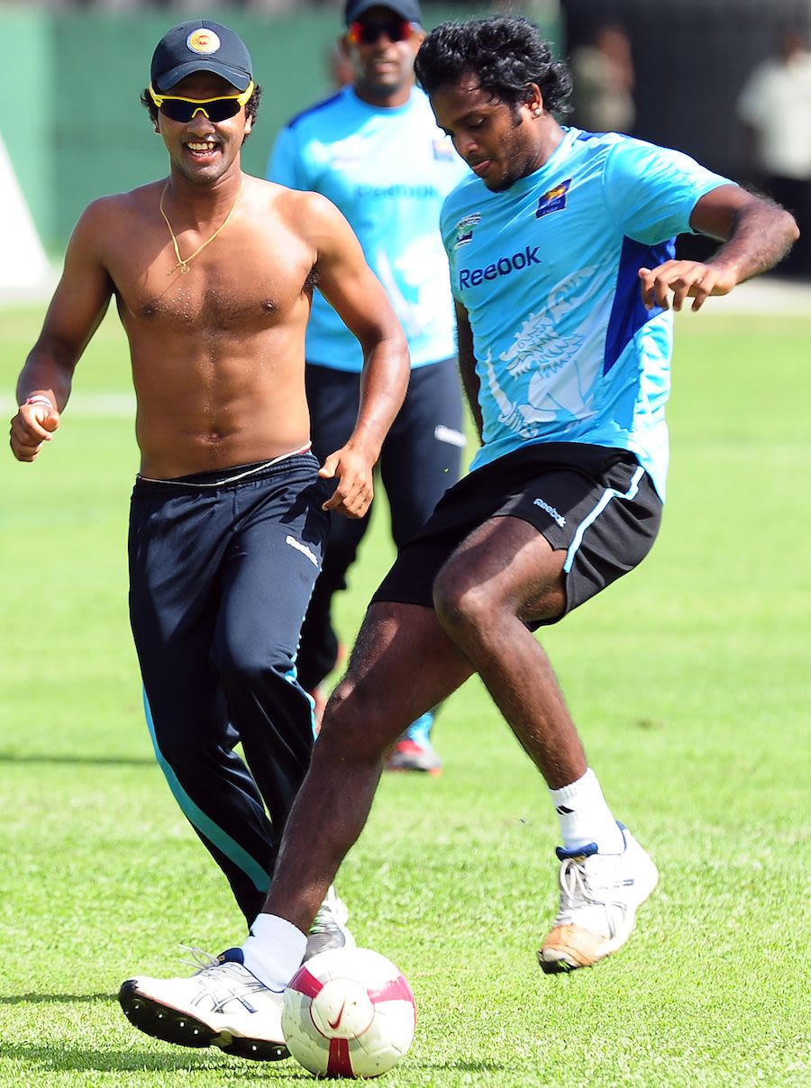 Dinesh Chandimal and Dilhara Fernando play football