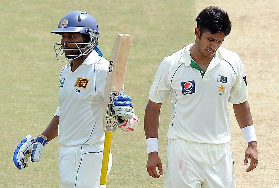 Tillakaratne Dilshan celebrates reaching his fifty, off the bowling of Aizaz Cheema