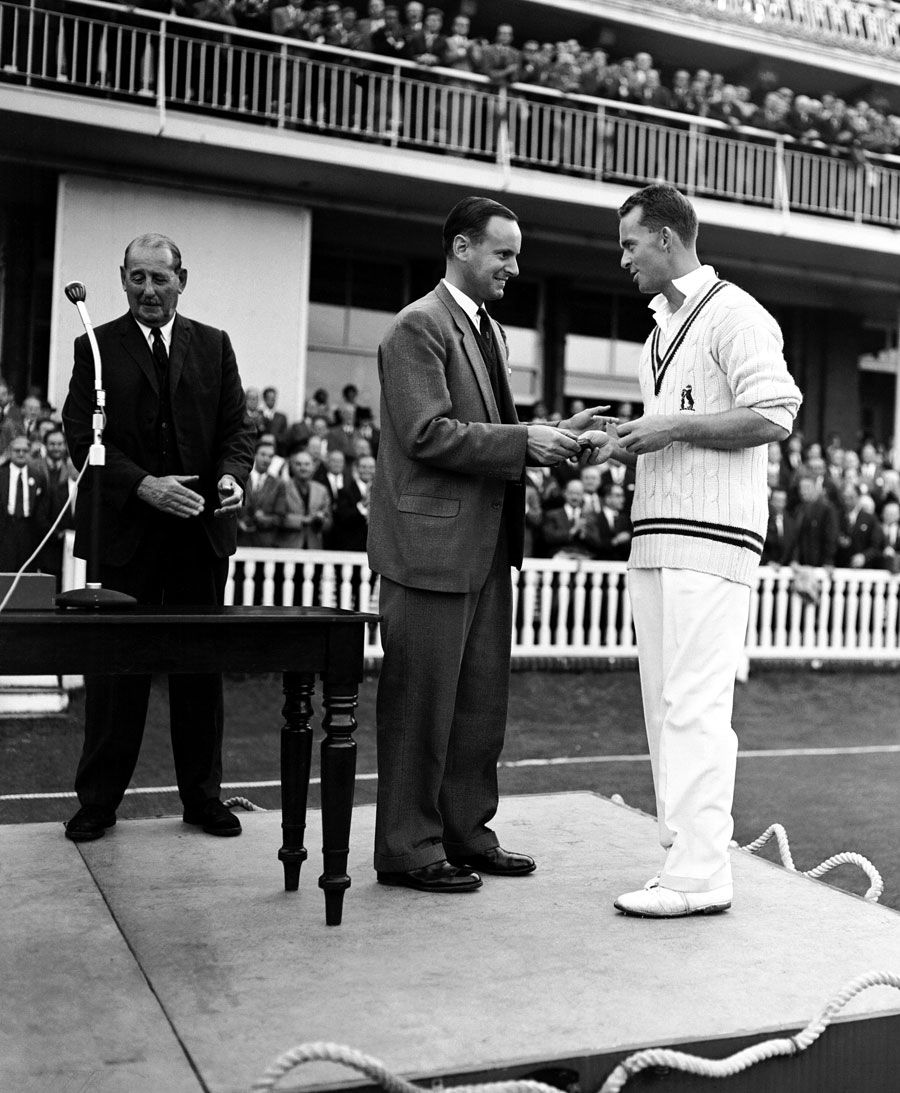 Peter May hands the Man of the Match award to Bob Barber