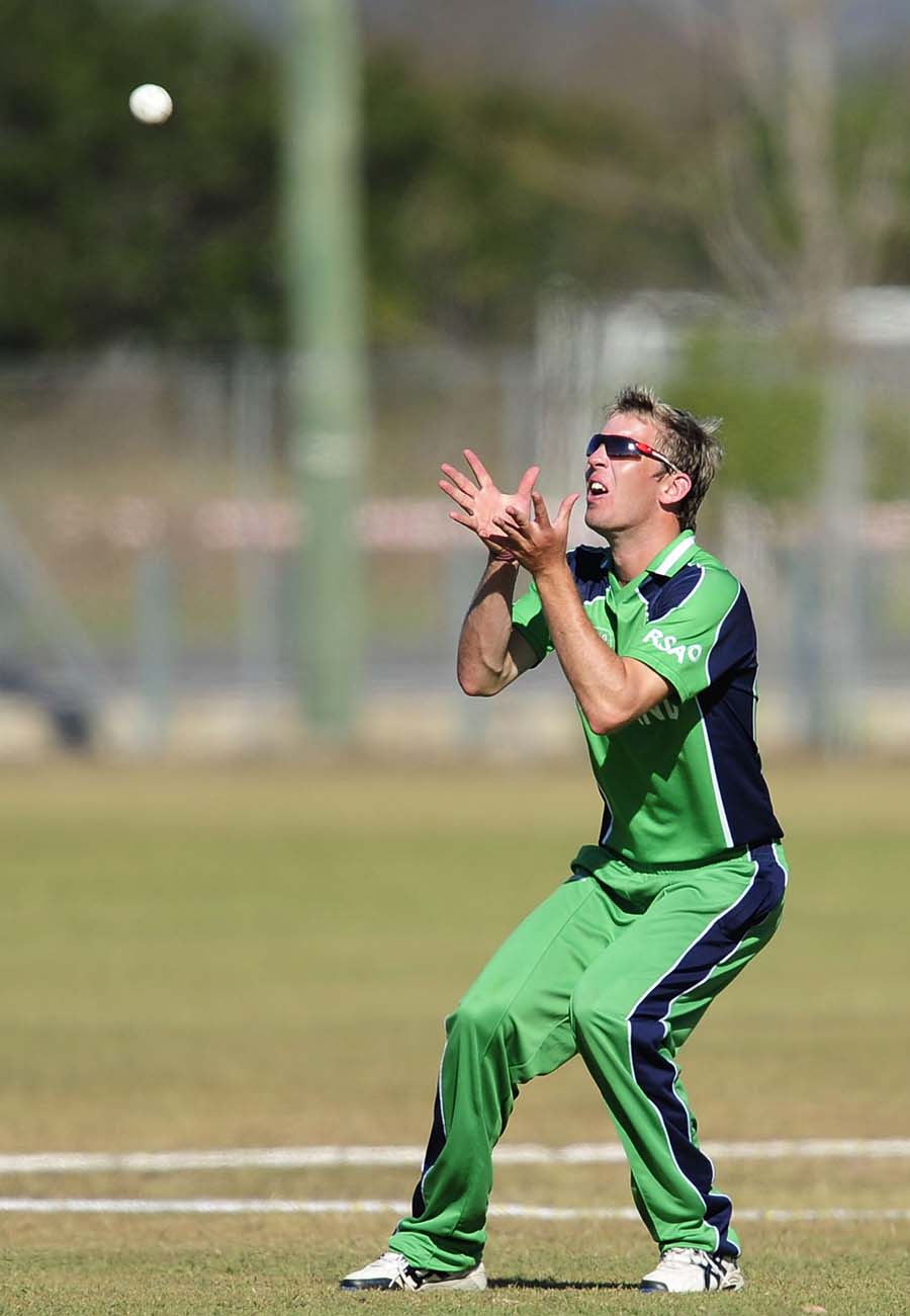 Graeme McCarter gets underneath the ball to take a catch and dismiss Prithu Baskota