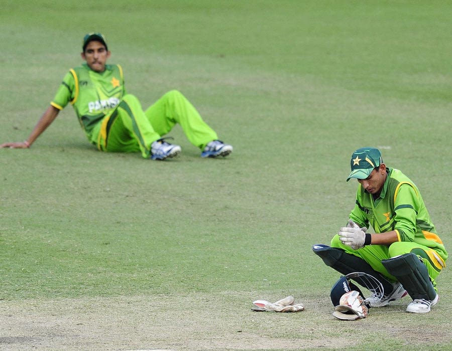 Wicketkeeper Salman Afridi is dejected after losing the quarter-final to India by one wicket