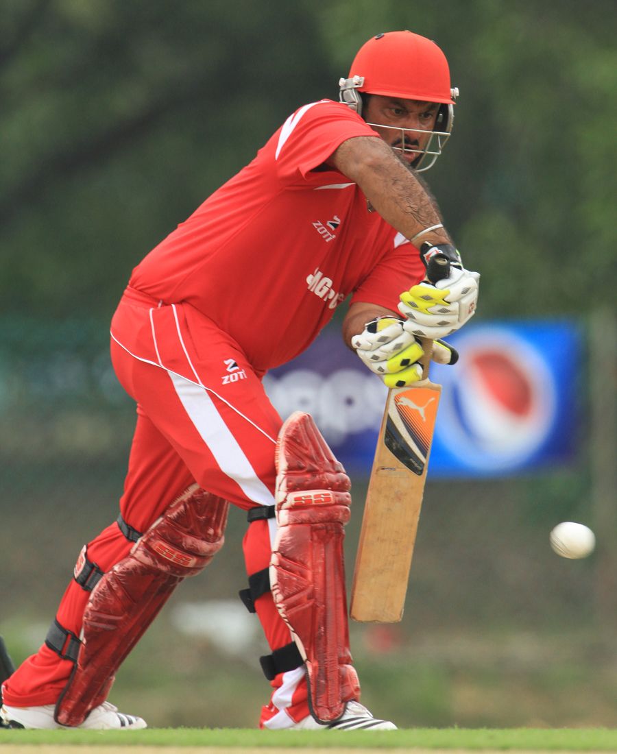 Singapore's Munish Arora plays the ball