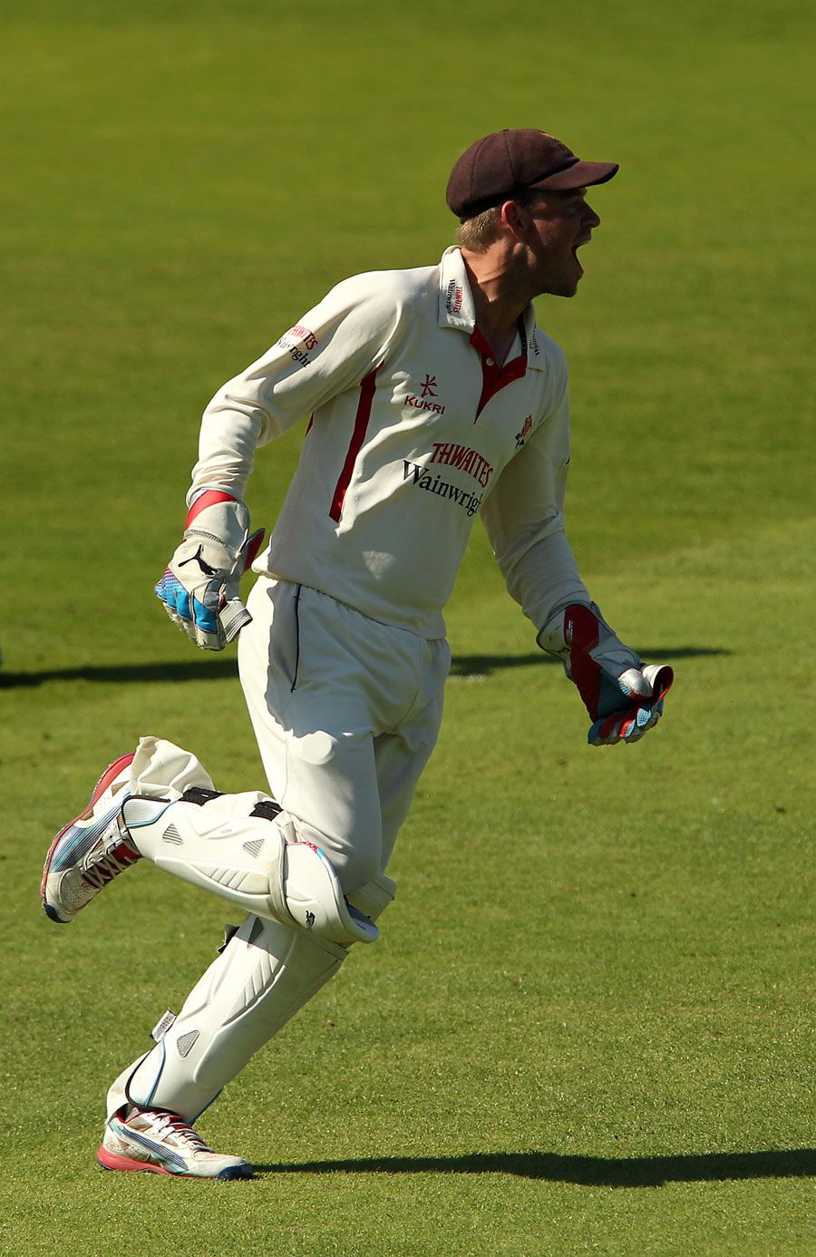 Gareth Cross claims the catch to get rid of John Simpson