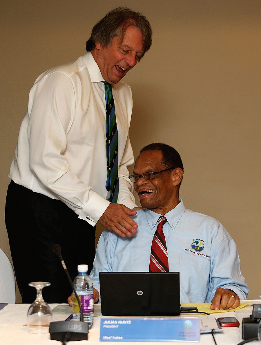 Giles Clarke shares a light moment with Julian Hunte