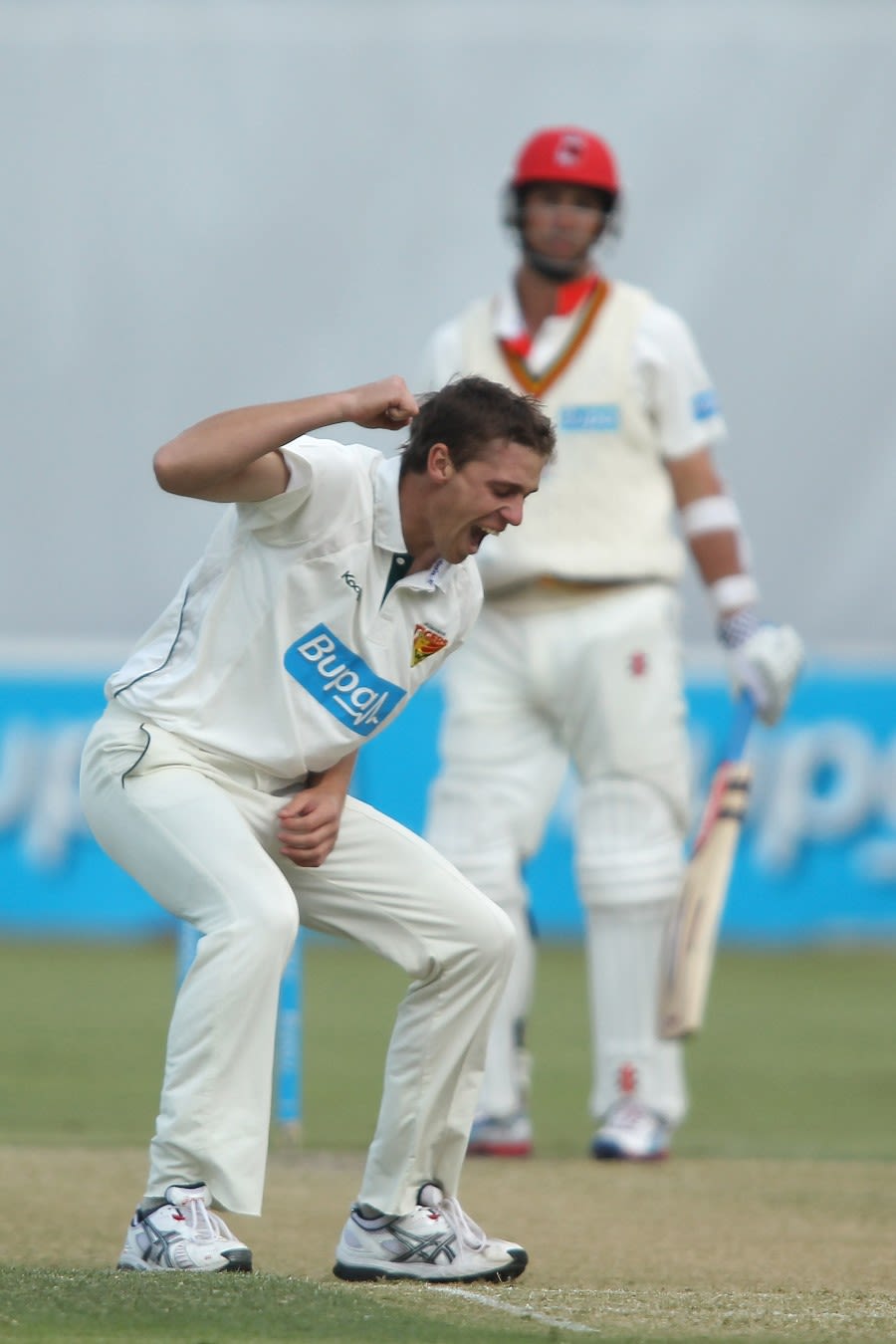 Luke Butterworth celebrates one of his five wickets