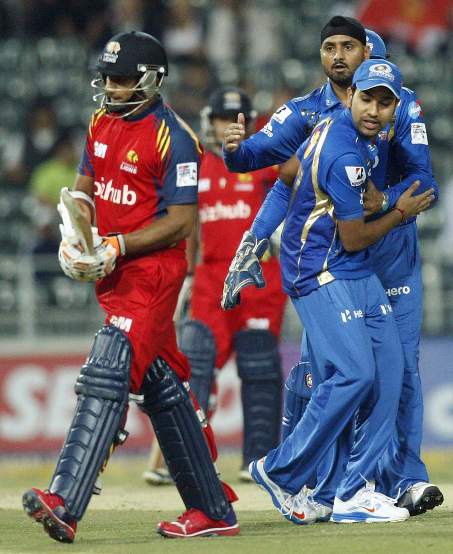Gulam Bodi walks back after being dismissed by Harbhajan Singh