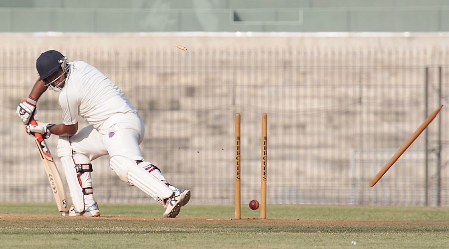 Maharashtra's Nikhil Paradkar is bowled