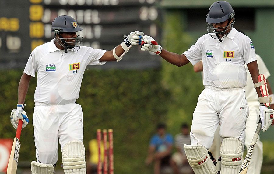 Thilan Samaraweera and Suraj Randiv punch gloves during their stand