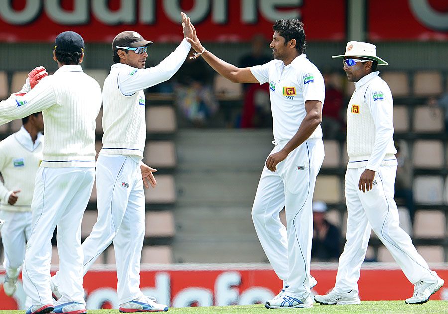 Chanaka Welegedara is congratulated for taking a wicket