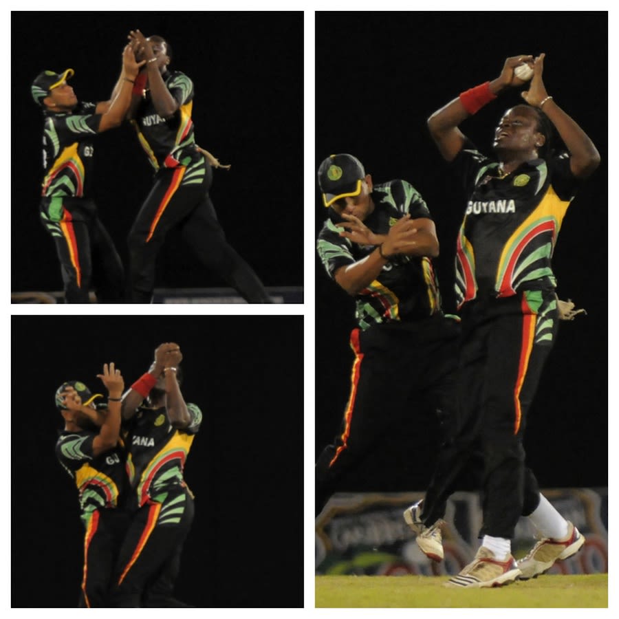 Steven Jacobs takes a catch after colliding with Ramnaresh Sarwan