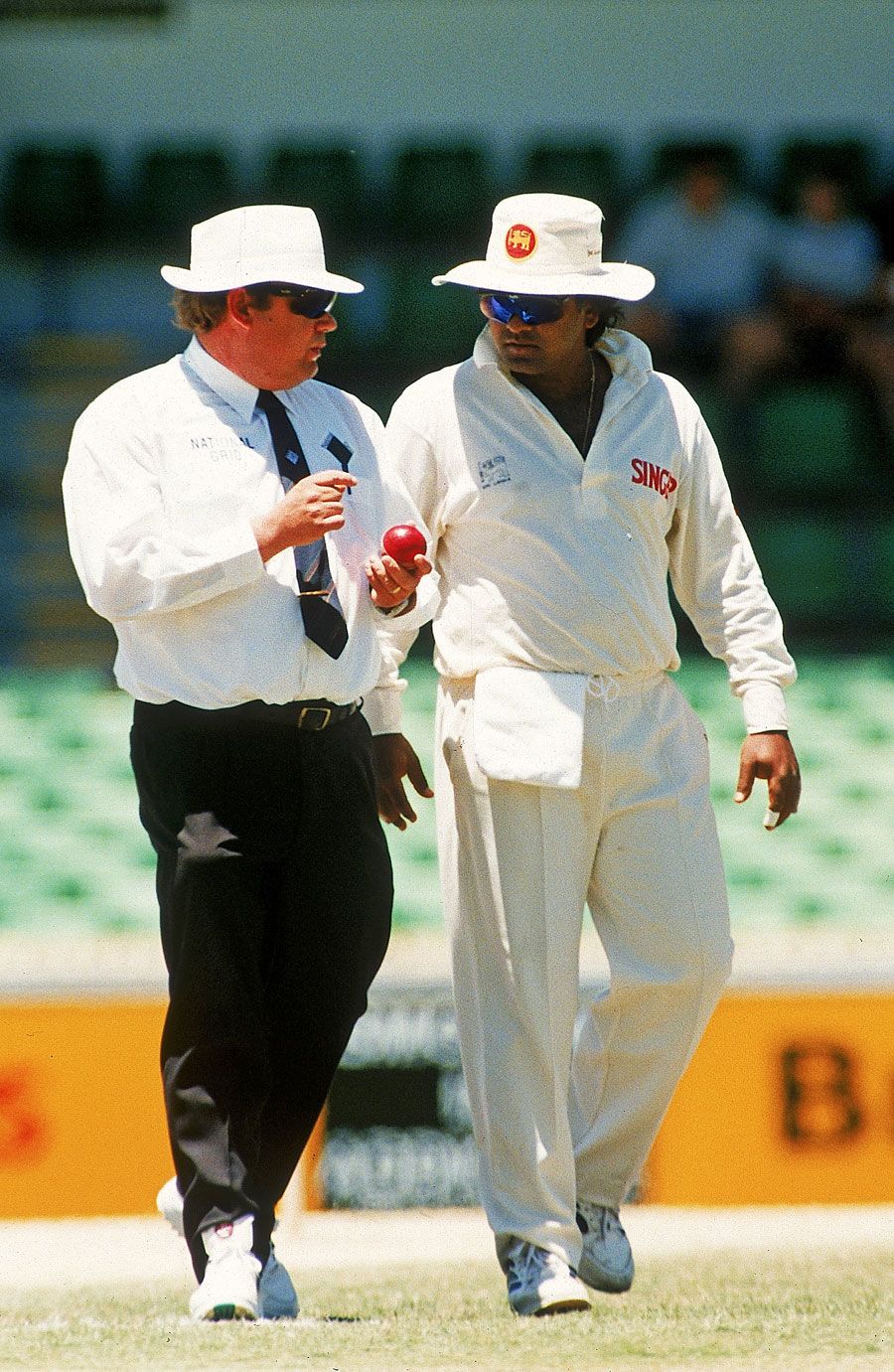 Umpire Peter Parker and Arjuna Ranatunga discuss the state of the ball