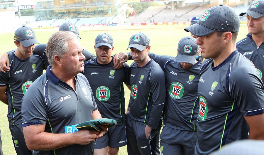 Steve Rixon hands debutant Moises Henriques his baggy green