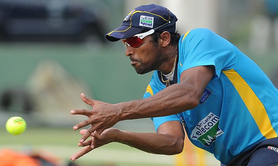 Chanaka Welegedara catches a ball during a practice session in Galle