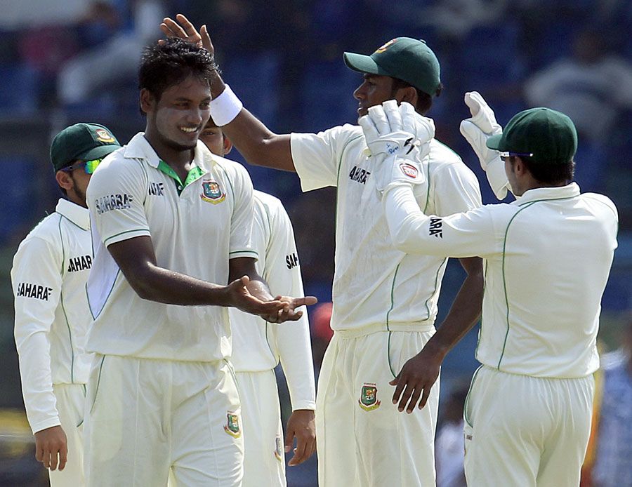 Abul Hasan celebrates a wicket with his team-mates