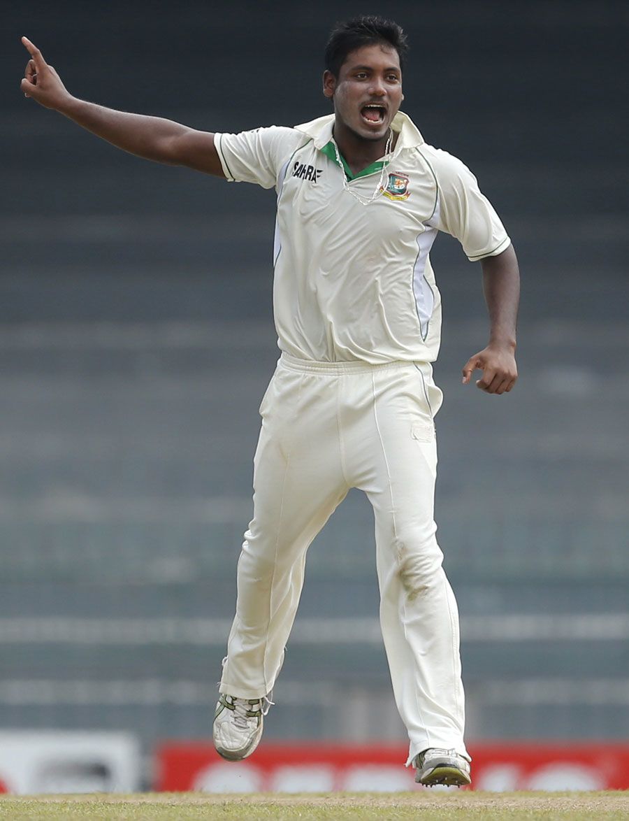 Abul Hasan celebrates the wicket of Dimuth Karunaratne