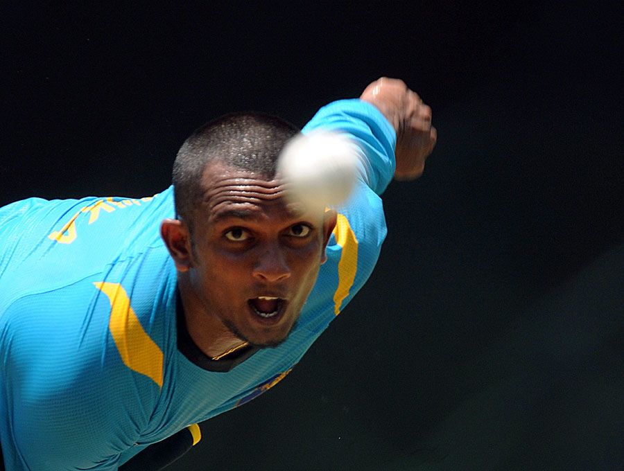 Ishan Jayaratne bowls during a practice session in Pallekele