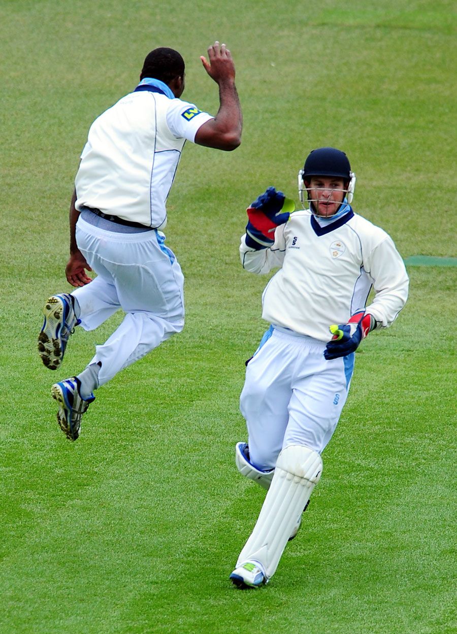 Chesney Hughes and Tom Poynton celebrate a wicket