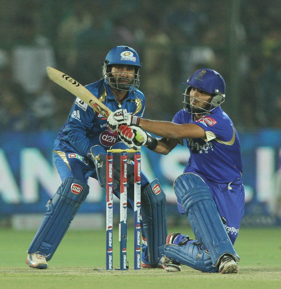 Dishant Yagnik sweeps during his innings of 34