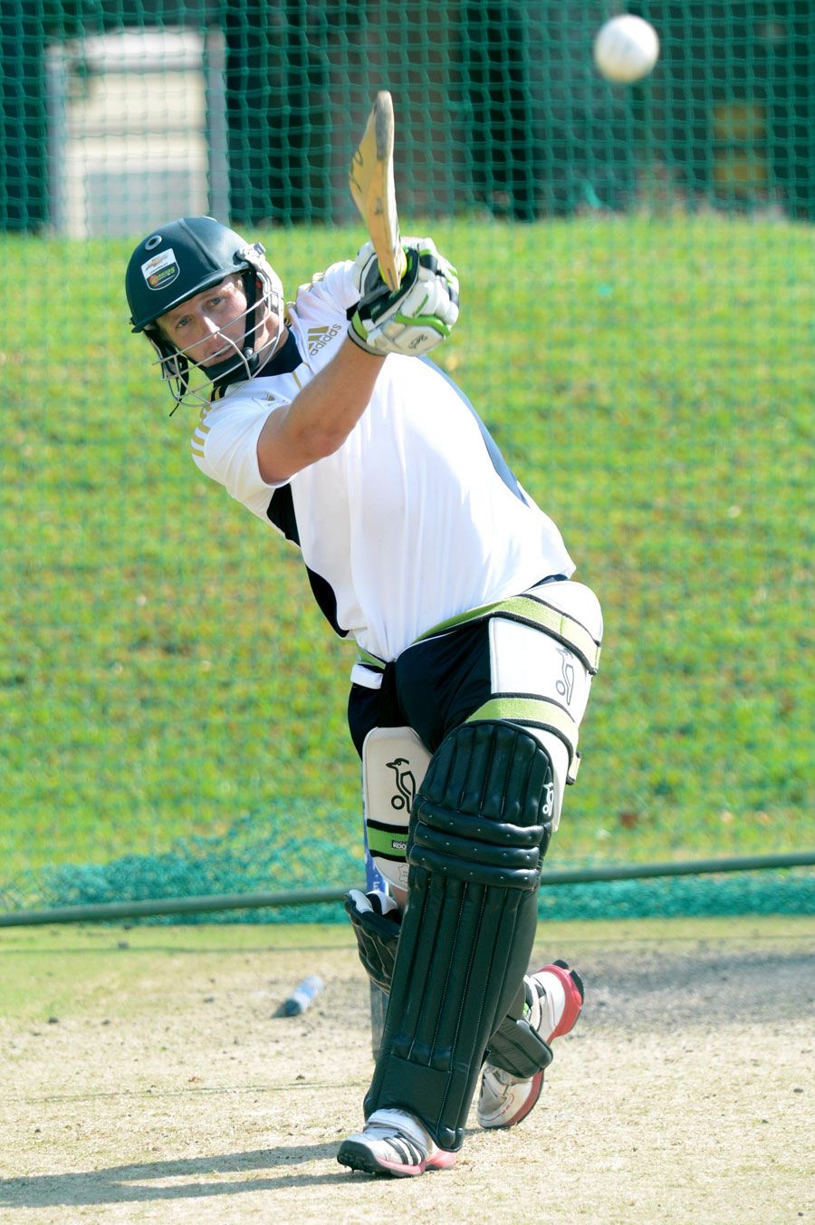 Andrew Birch clubs one during a South Africa Emerging Squad nets session