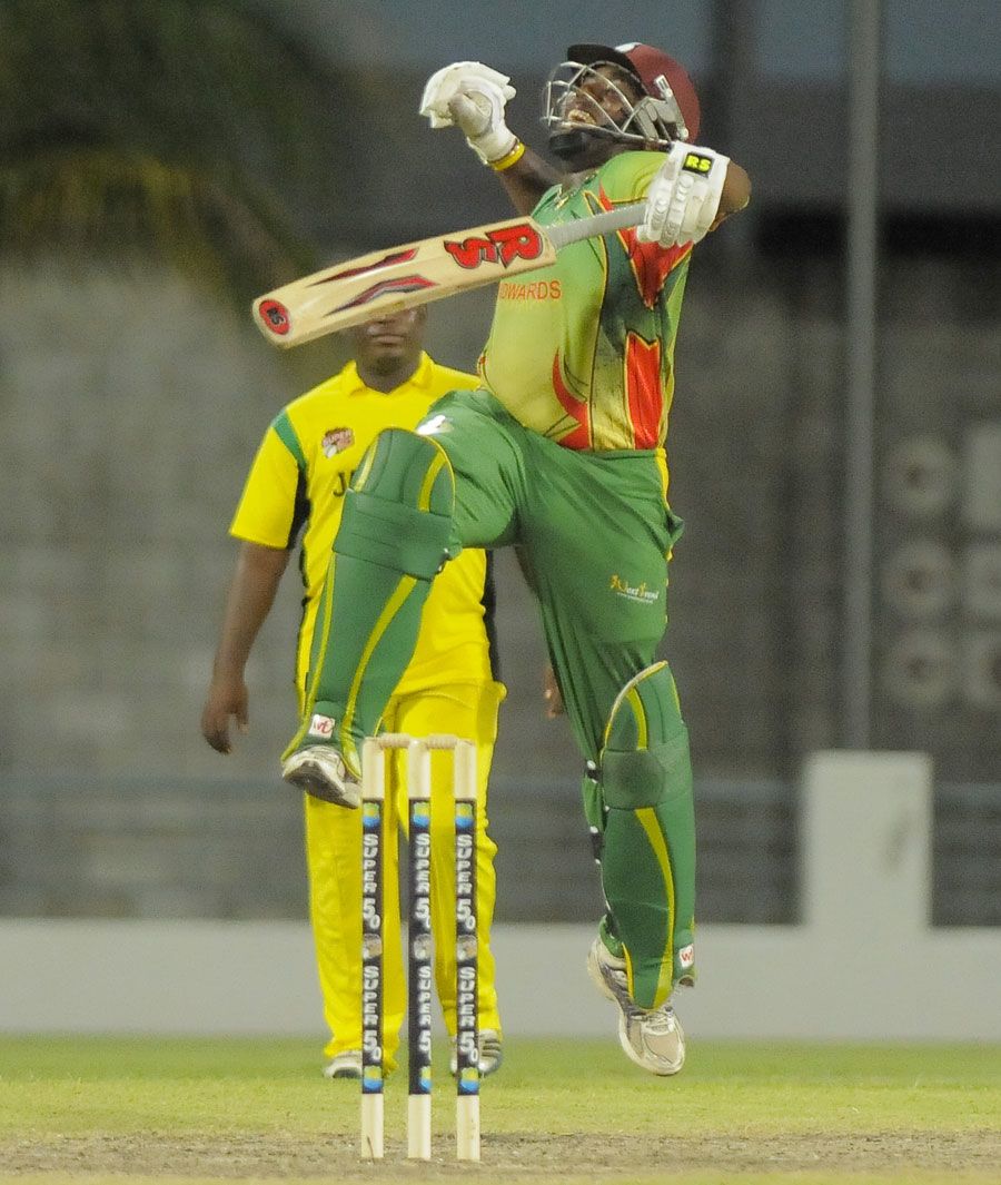 Windward Islands captain Liam Sebastien celebrates after scoring the winning runs