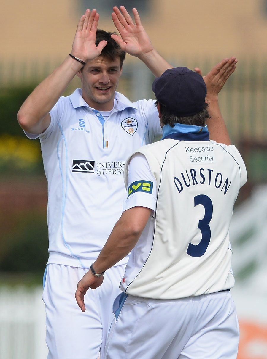 Jonathan Clare gets a high five from Wes Durston