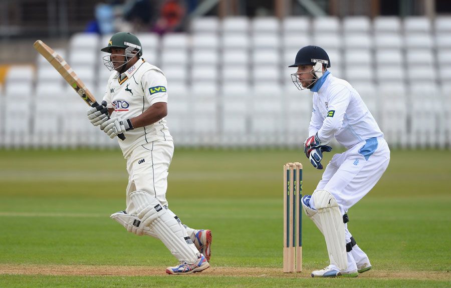 Samit Patel plays a shot as Tom Poynton looks on