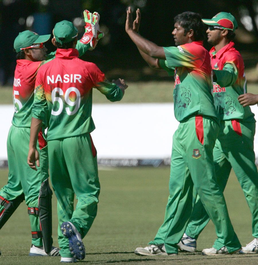 Robiul Islam celebrates a wicket with team mates