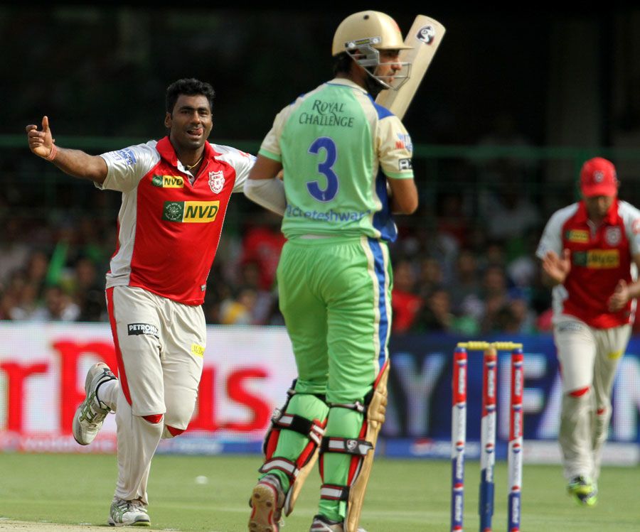 Parvinder Awana celebrates after taking Cheteshwar Pujara's wicket
