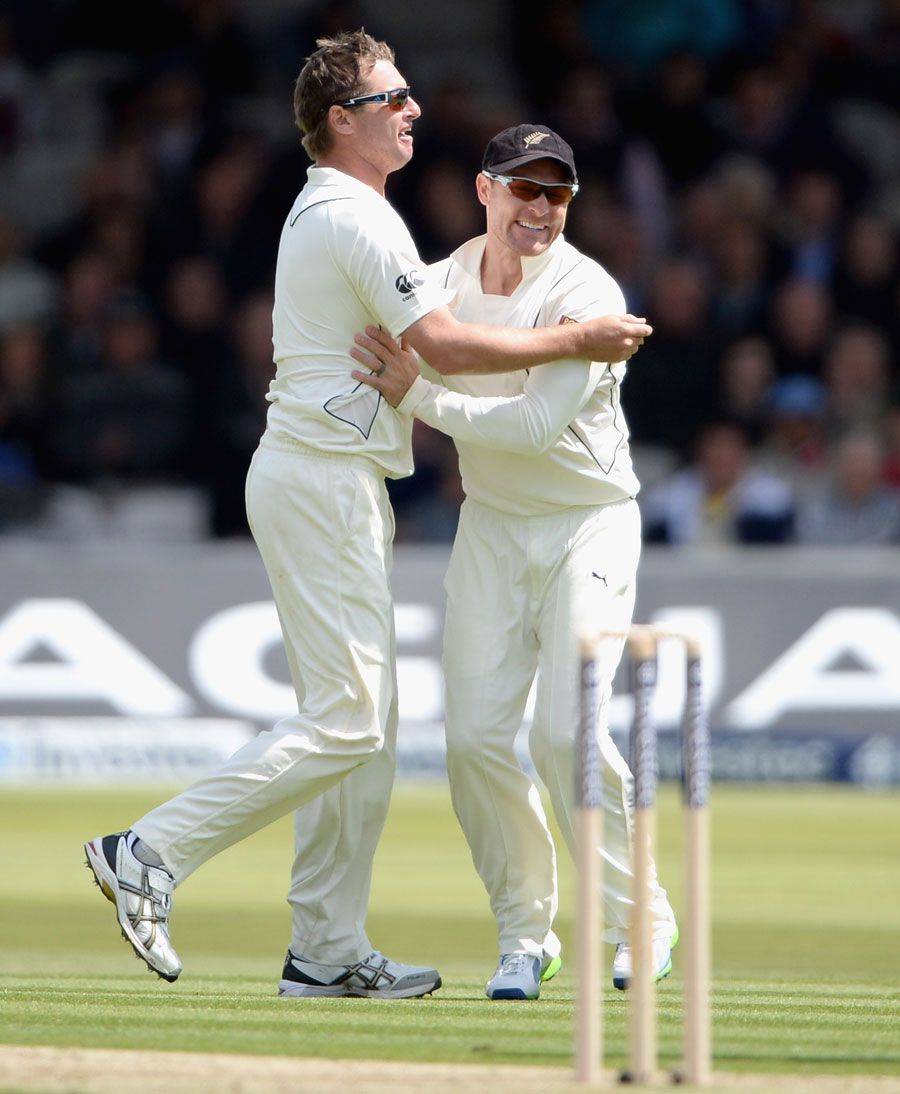 Bruce Martin celebrates his wicket with Brendon McCullum