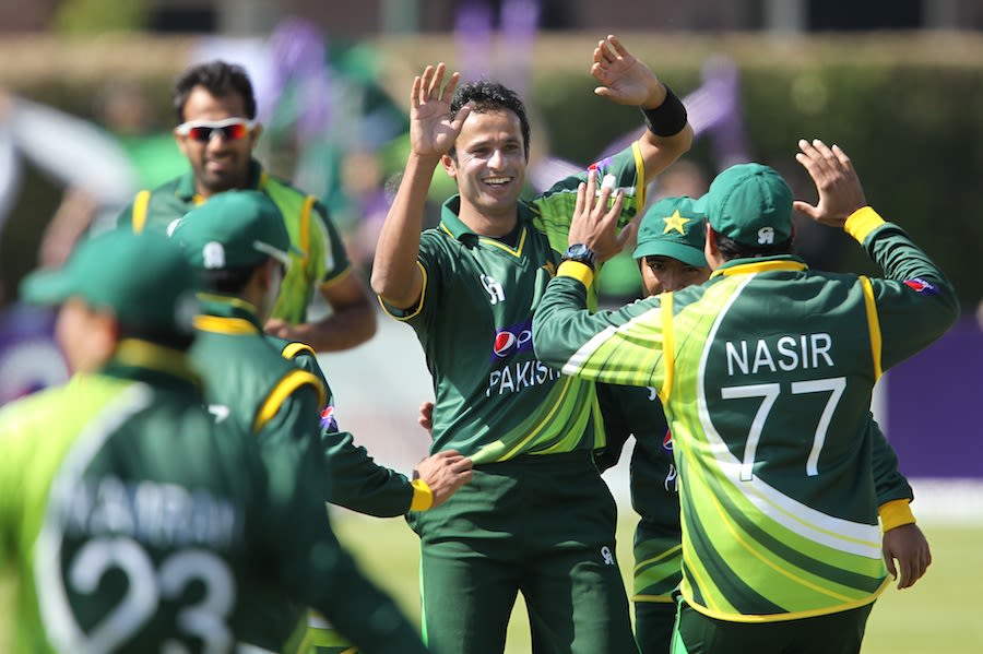 Asad Ali celebrates his first international wicket with team mates