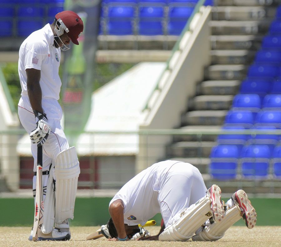 Assad Fudadin prays after scoring a hundred