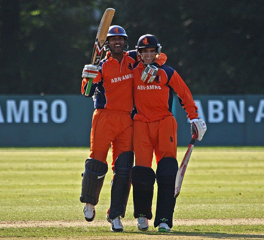 Ahsan Malik and Michael Rippon celebrate the tie