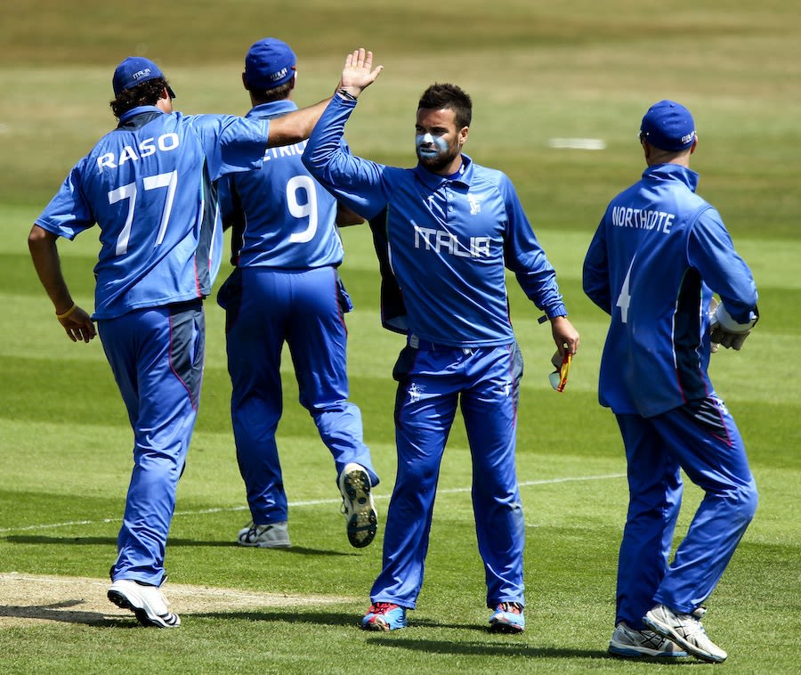 Carl Sandri celebrates a wicket with team-mates