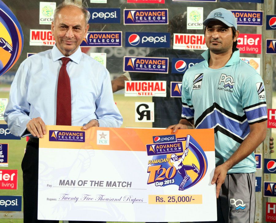 Azam Hussain with the Man-of-the-Match award