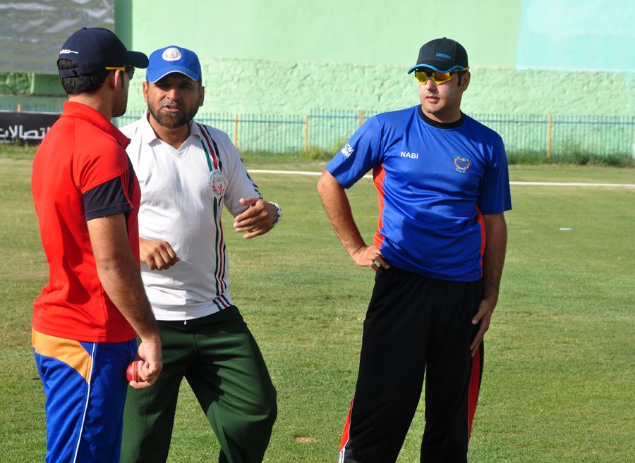 Afghanistan coach Kabir Khan advises players at a training camp