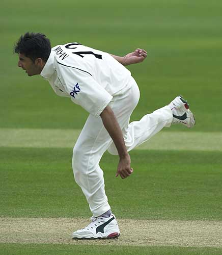 Nadeem Malik on his way to a 5-fer in the University first innings