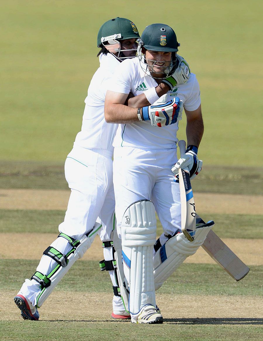 Dean Elgar is congratulated by Thami Tsolekile
