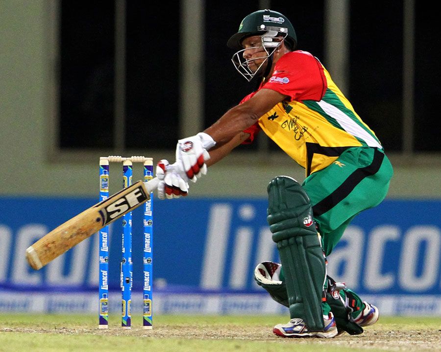 Ramnaresh Sarwan throws his bat at one