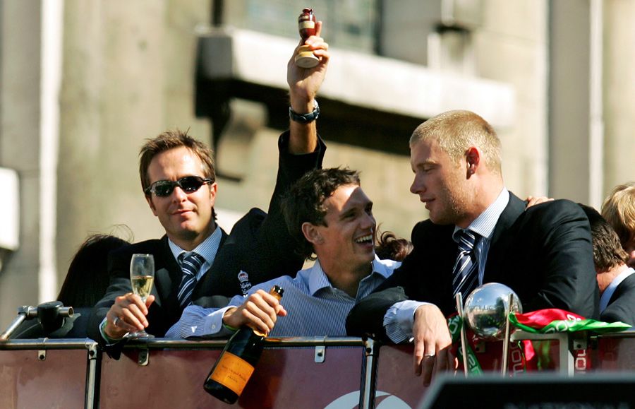 Michael Vaughan, Gary Pratt and Andrew Flintoff ride on top of the bus in the victory parade