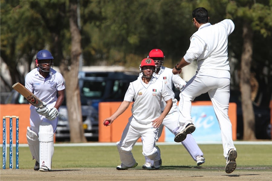 Afghanistan players celebrate the wicket of Pikky Ya France