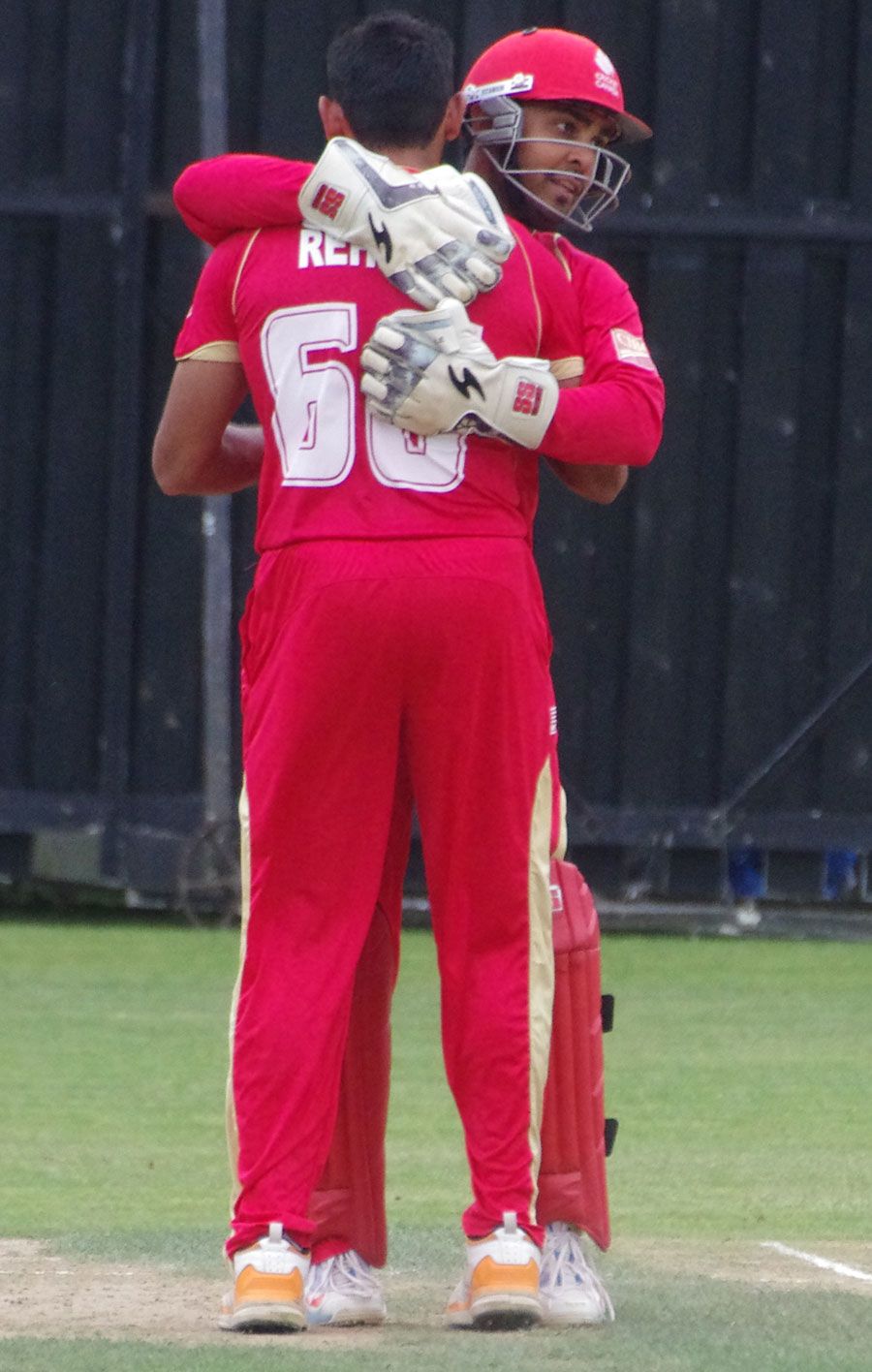 Raza-ur-Rehman celebrates a wicket with Ashish Bagai